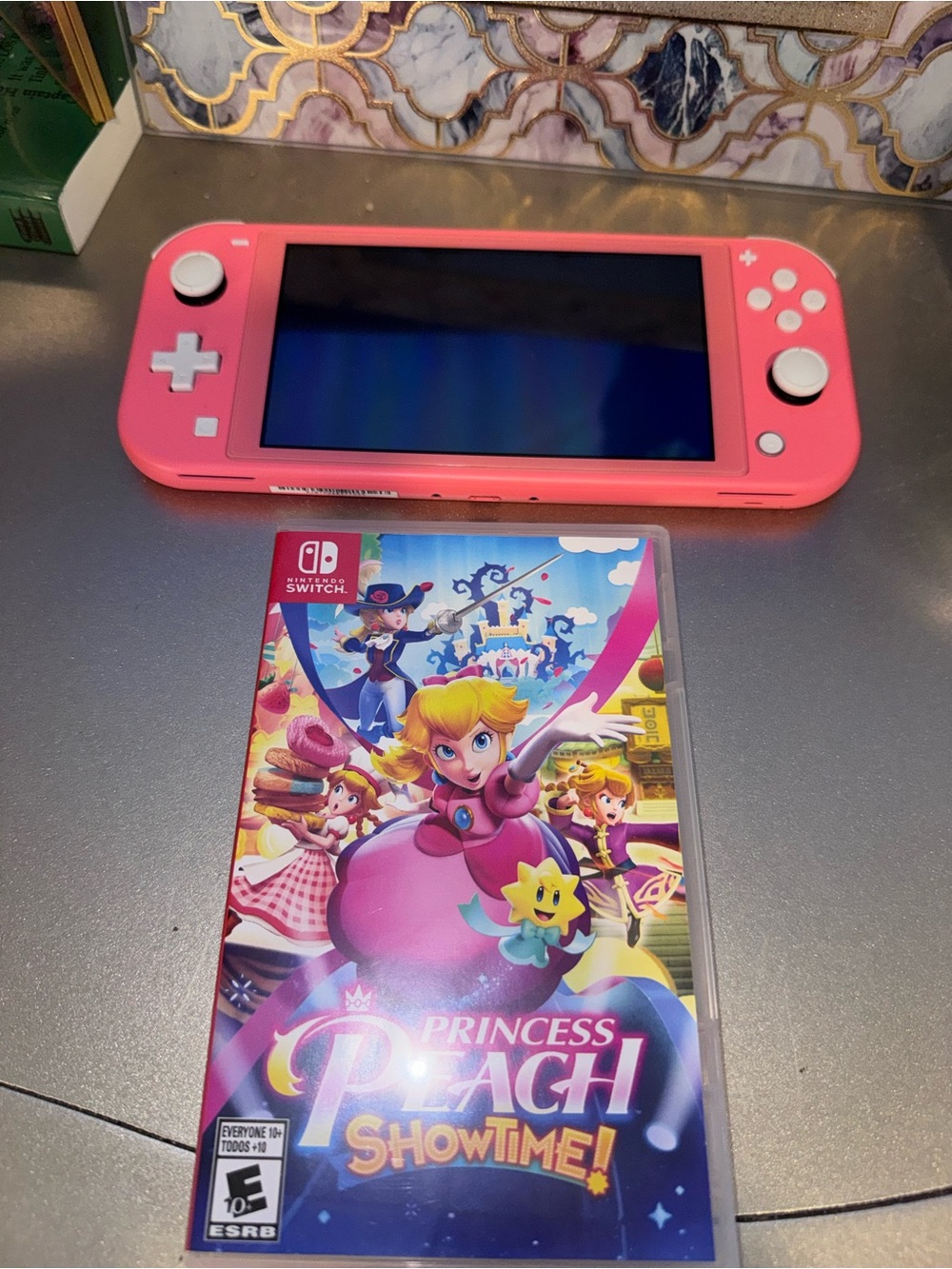 Nintendo Switch Lite Coral Pink Handheld Console with Princess Peach Showtime